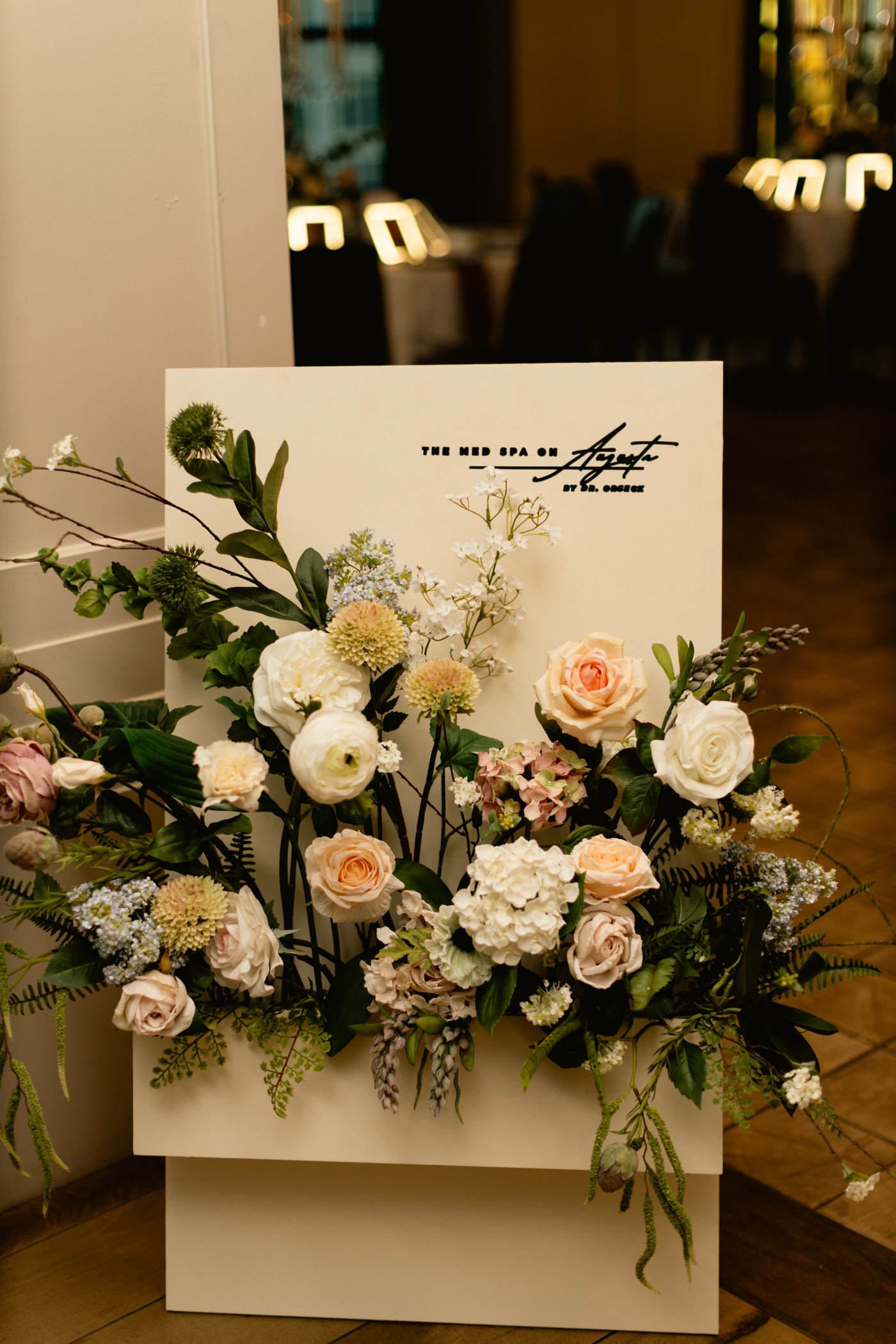 The Med Spa on Augusta welcome signage with floral installation
