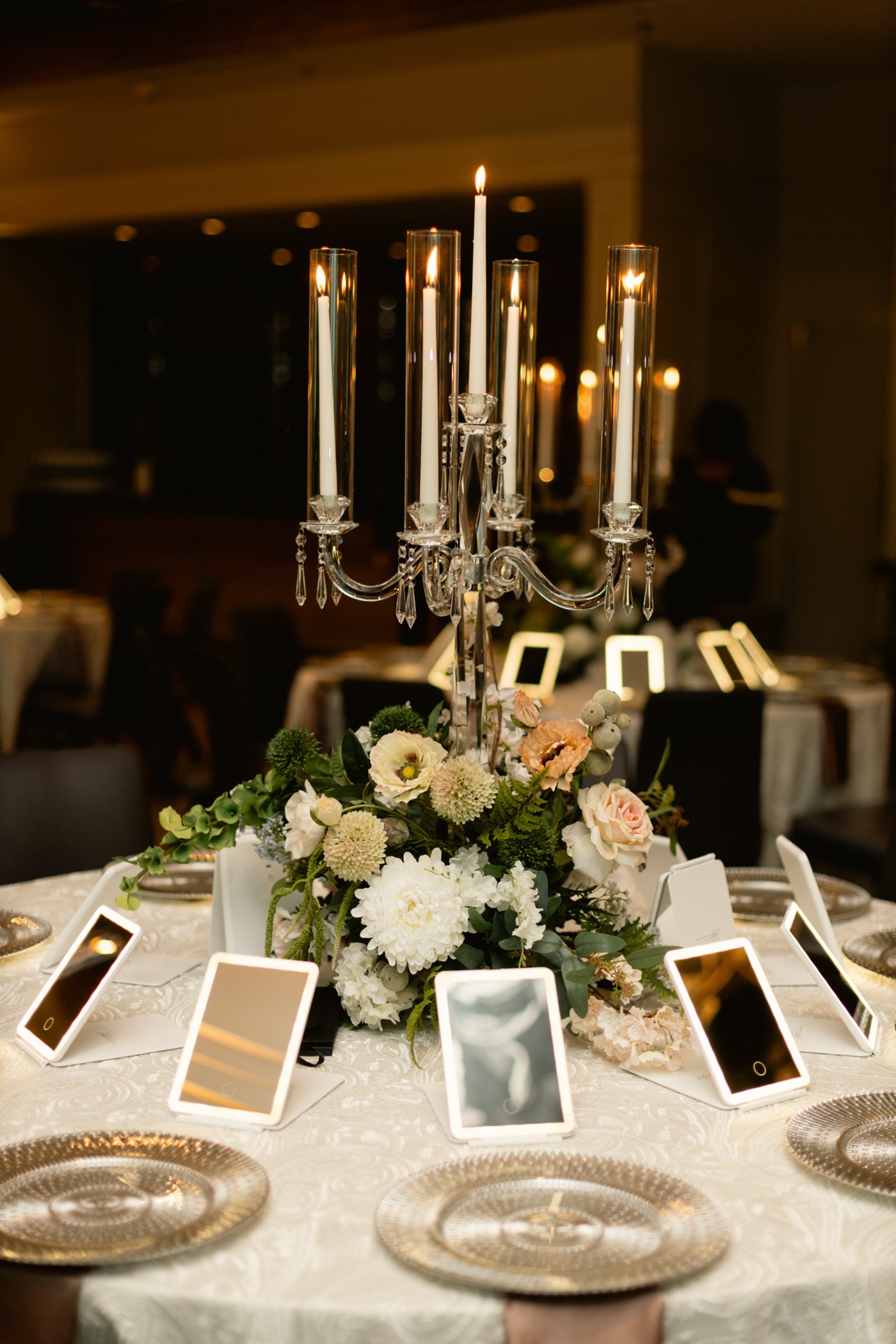 Tablescape with lighted vanity mirrors and crystal candelabra