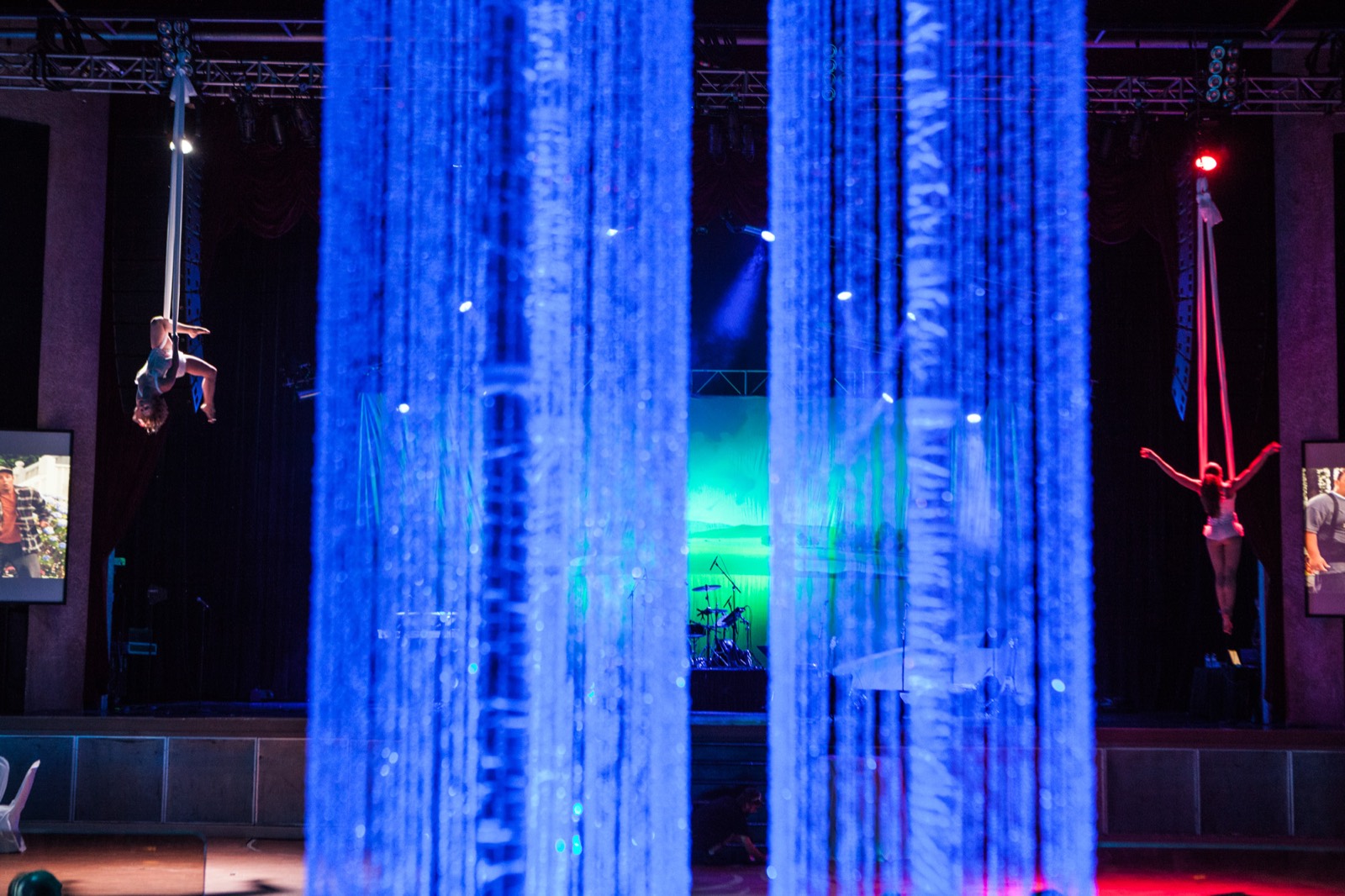 A ballroom washed in blue light