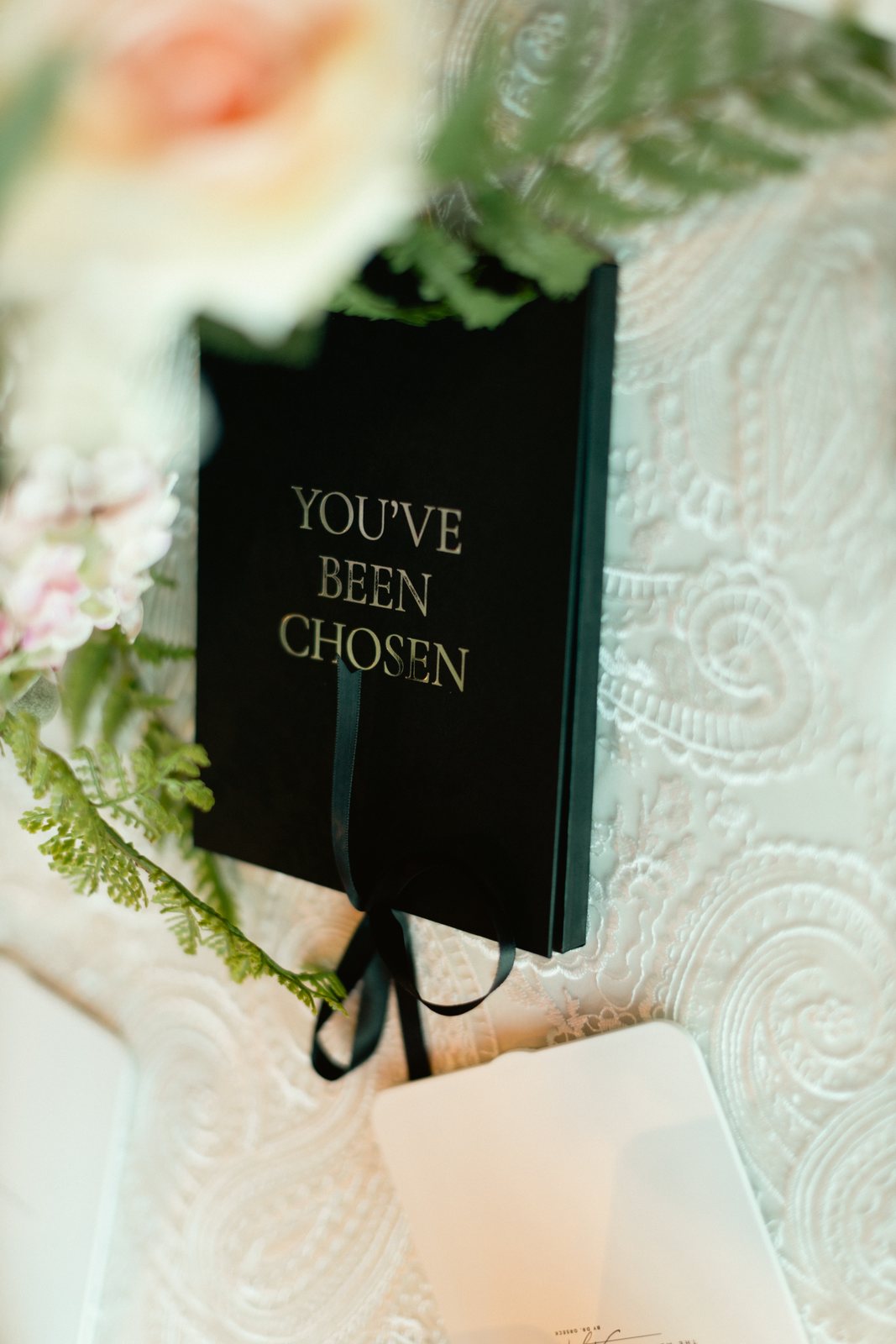 The invitation, You&rsquo;ve Been Chosen in gold foil
