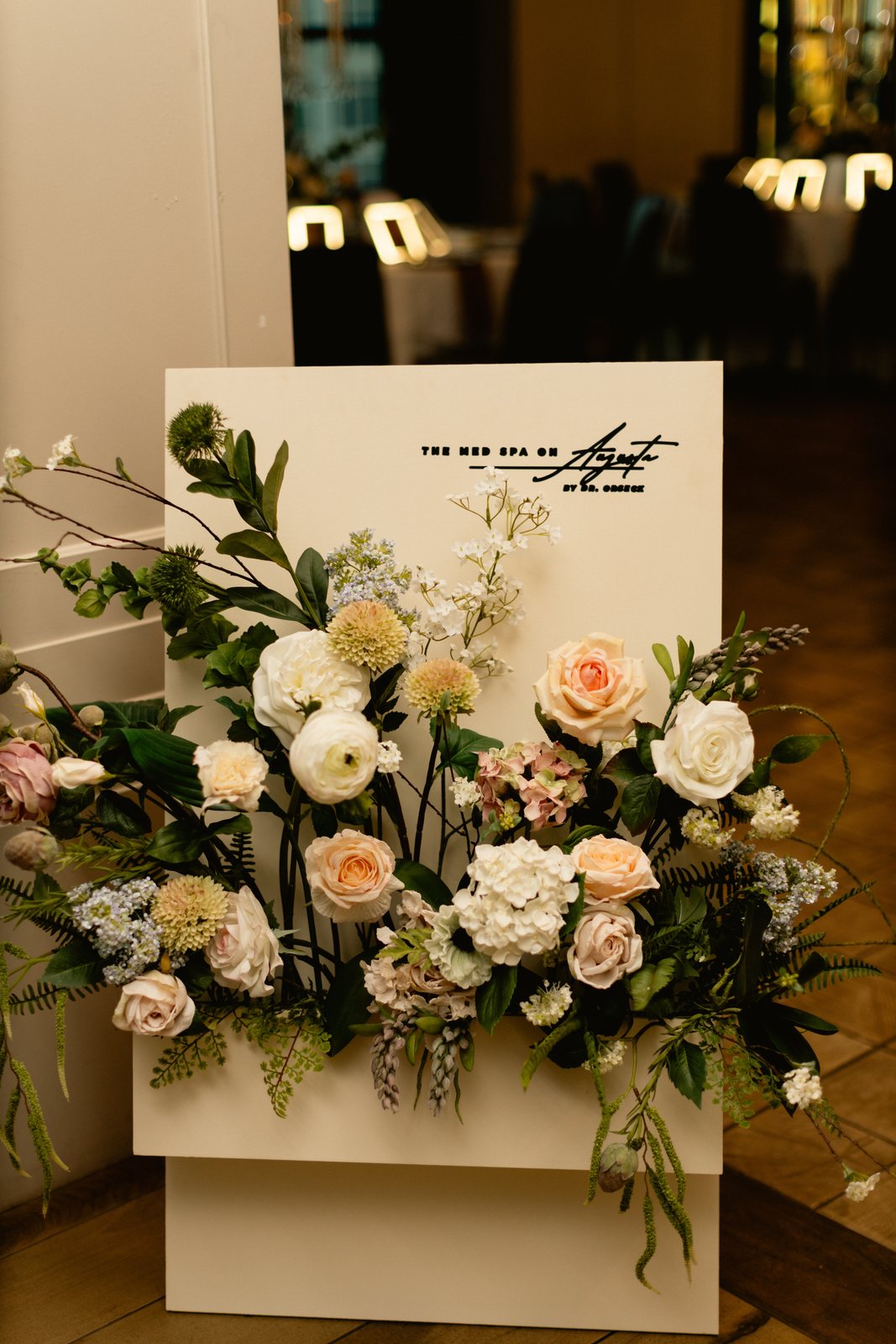 Florals beneath the Med Spa on Augusta signage