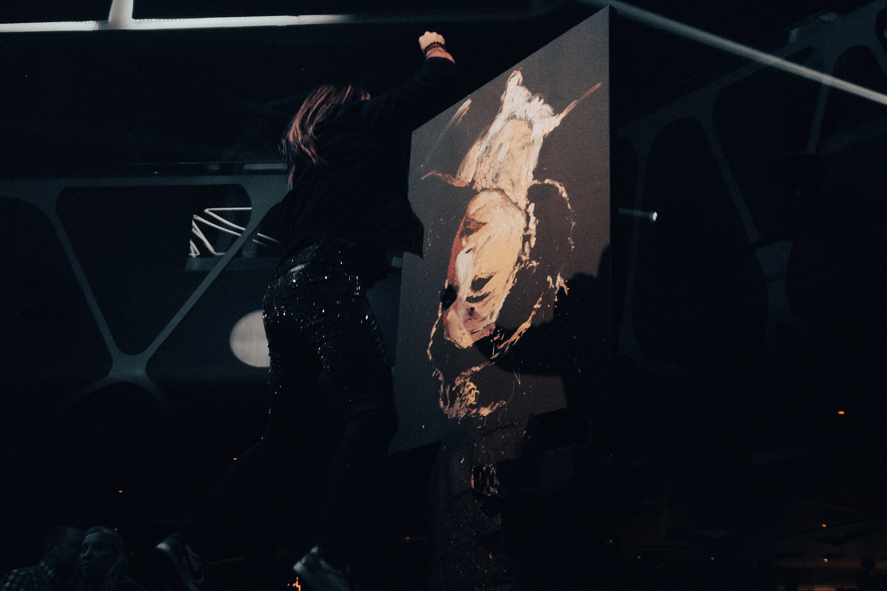 A vocalist performing on the floor