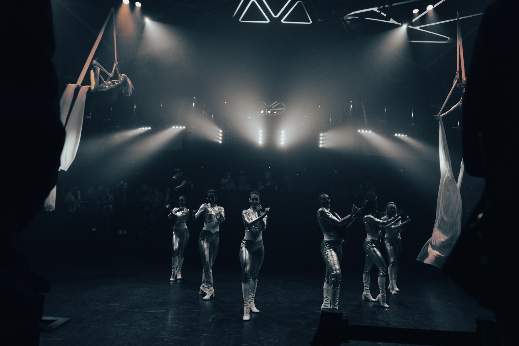 Dancers mid-performance on the floor